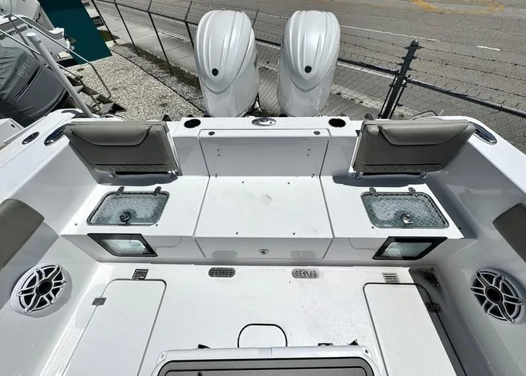  Yacht Photos Pics 2025 Sportsman Heritage 261 boat deck with dual engines and seating.