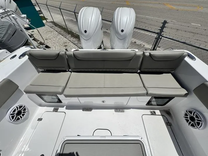  Yacht Photos Pics 2025 Sportsman Heritage 261 boat interior with cushioned seating and dual outboard motors.