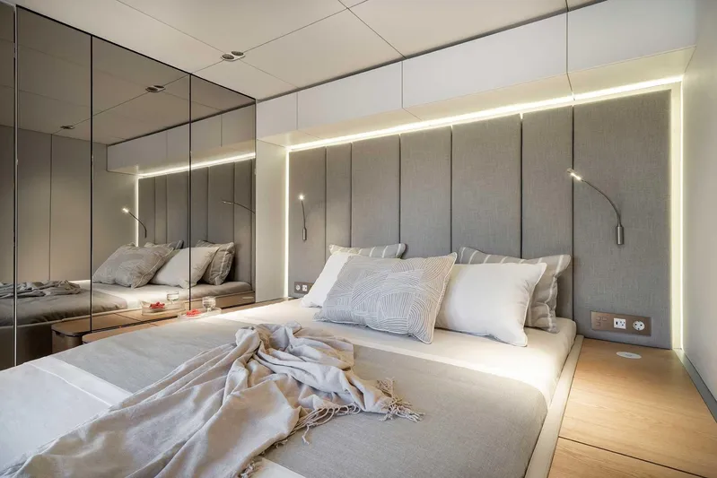  Yacht Photos Pics Luxurious bedroom interior on 2026 Sunreef 70 Sunreef Power yacht, featuring modern design and ambient lighting.