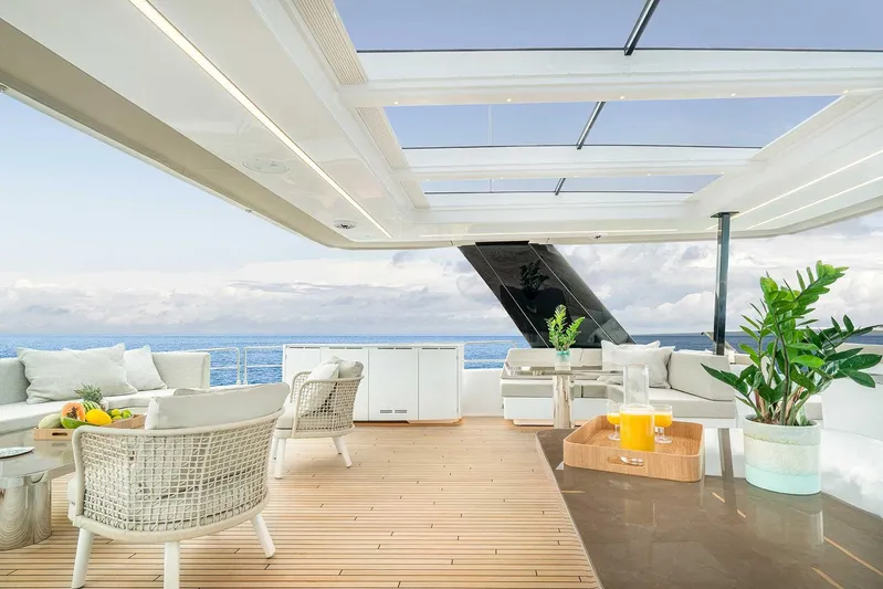 Yacht Photos Pics Luxurious 2026 Sunreef 70 Power yacht deck with elegant seating and ocean view.