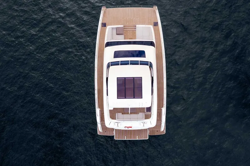  Yacht Photos Pics Aerial view of 2026 Sunreef 70 Sunreef Power yacht on open water.