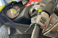 2014 Sea-Doo 260 RXT handlebar and dashboard in a garage setting.
