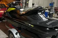 2014 Sea-Doo 260 RXT jet ski on trailer in garage setting.