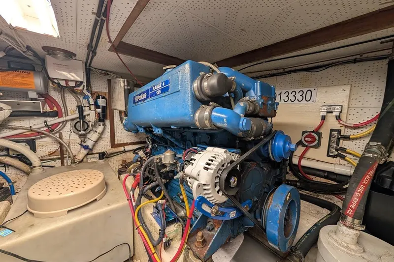 Positive Space Yacht Photos Pics Engine room of a 1987 DeFever Trawler featuring a Perkins Range 4 135 engine.