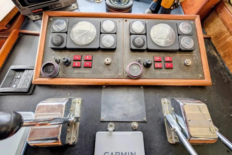 Positive Space Yacht Photos Pics 1987 DeFever Trawler control panel with Perkins engine gauges and Garmin navigation system.