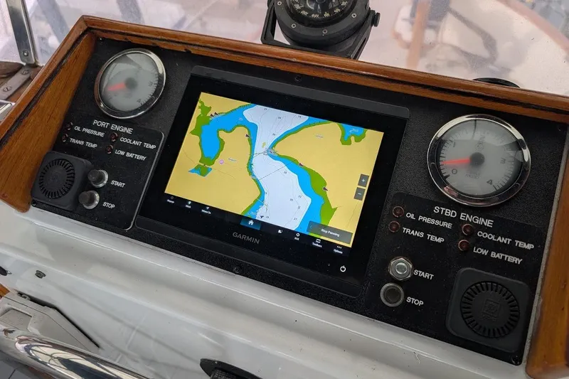 Positive Space Yacht Photos Pics 1987 DeFever Trawler dashboard with Garmin navigation and engine gauges.