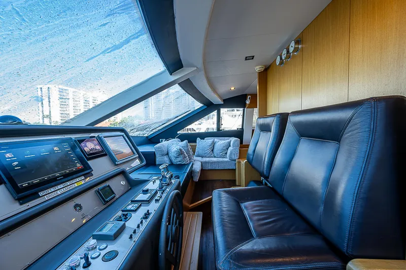 Twe11ve Yacht Photos Pics Interior of 2009 Ferretti Yachts 780 MY, featuring luxurious leather seating and modern navigation controls.