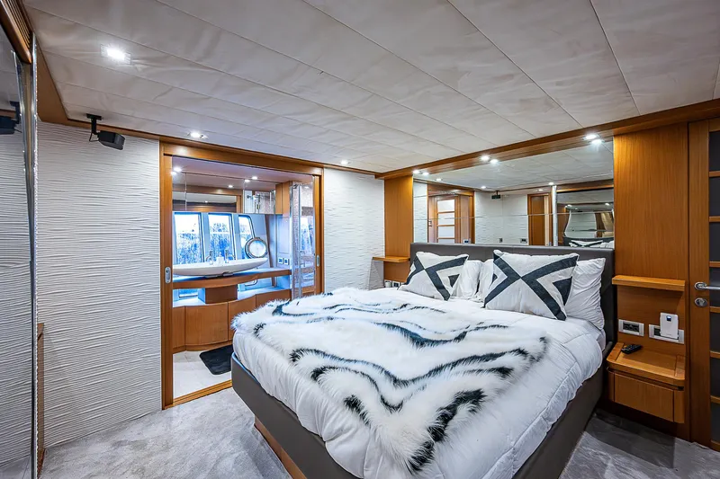 Twe11ve Yacht Photos Pics Luxurious bedroom interior of 2009 Ferretti Yachts 780 MY with modern design and cozy bedding.
