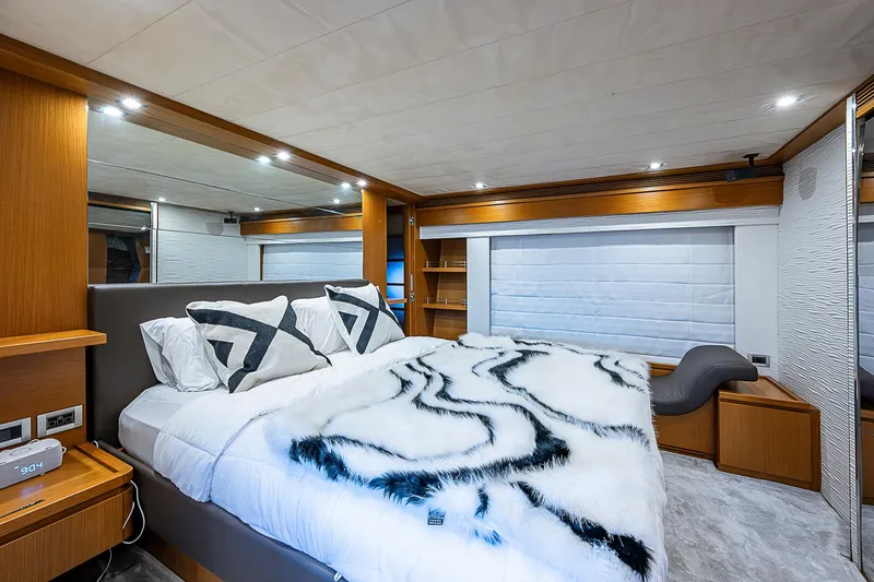 Twe11ve Yacht Photos Pics Luxurious bedroom interior of 2009 Ferretti Yachts 780 MY with modern decor and plush bedding.