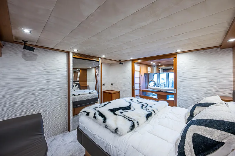 Twe11ve Yacht Photos Pics Luxurious bedroom interior of 2009 Ferretti Yachts 780 MY with modern decor and plush bedding.