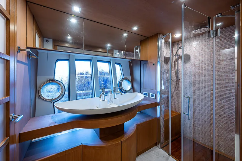 Twe11ve Yacht Photos Pics Luxurious bathroom in 2009 Ferretti Yachts 780 MY with modern fixtures and elegant design.