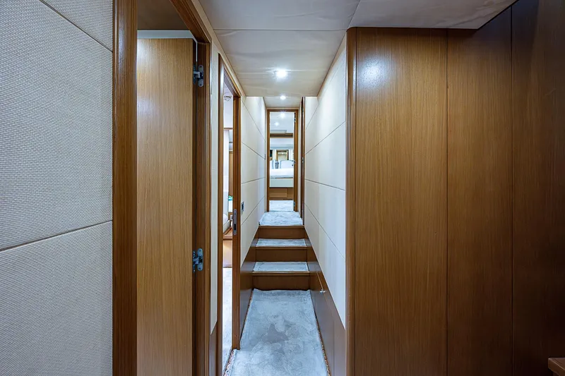 Twe11ve Yacht Photos Pics Interior hallway of 2009 Ferretti Yachts 780 MY, featuring wood paneling and carpeted steps.