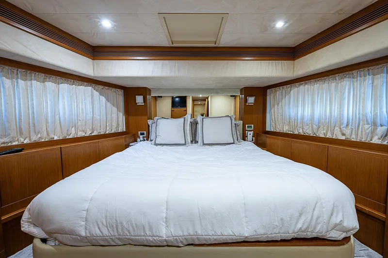 Twe11ve Yacht Photos Pics Luxurious bedroom interior of 2009 Ferretti Yachts 780 MY with elegant wood paneling.