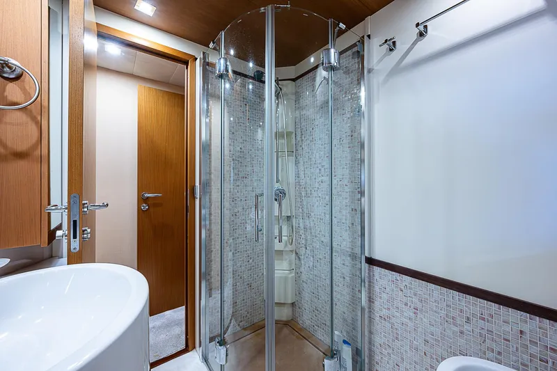 Twe11ve Yacht Photos Pics Luxurious bathroom in 2009 Ferretti Yachts 780 MY with modern shower and sleek design.