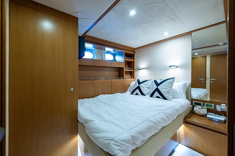 Twe11ve Yacht Photos Pics Luxurious bedroom interior of 2009 Ferretti Yachts 780 MY with modern wood finishes.