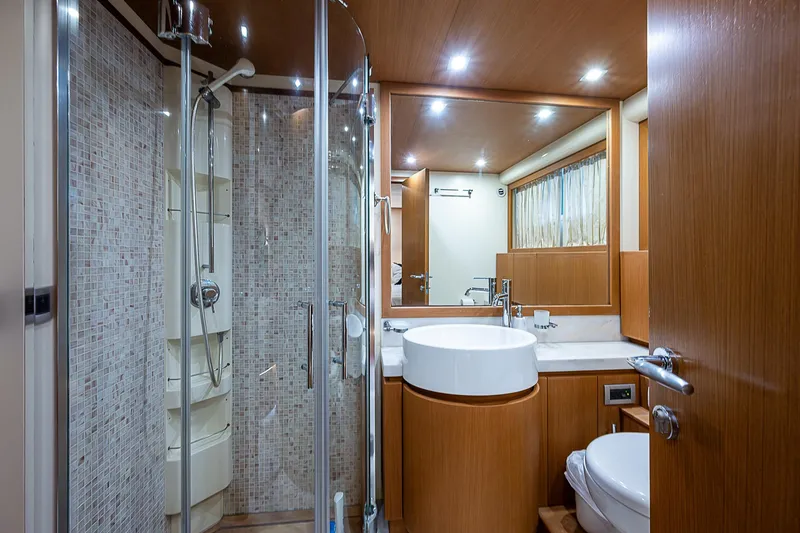 Twe11ve Yacht Photos Pics Luxurious bathroom in 2009 Ferretti Yachts 780 MY with modern fixtures and elegant design.