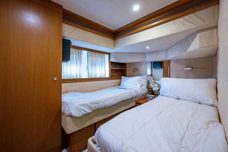 Twe11ve Yacht Photos Pics Luxurious twin cabin in 2009 Ferretti Yachts 780 MY, featuring elegant wood finishes.