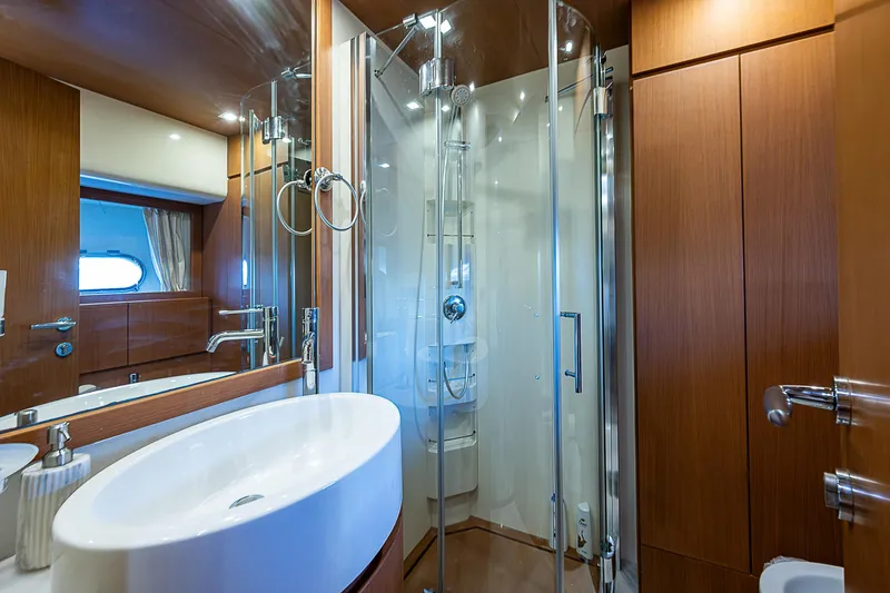 Twe11ve Yacht Photos Pics Luxurious bathroom on 2009 Ferretti Yachts 780 MY with modern fixtures and glass shower.