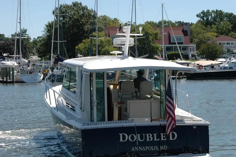 Double D Yacht Photos Pics 2014 Back Cove 37 boat in marina, Annapolis, MD, with American flag.