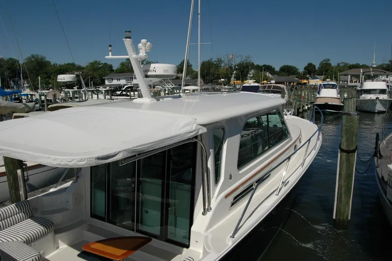 Double D Yacht Photos Pics 2014 Back Cove 37 yacht docked at marina under clear blue sky.