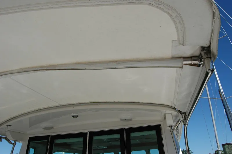 Double D Yacht Photos Pics 2014 Back Cove 37 boat canopy and structure detail under clear sky.