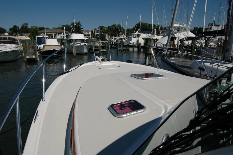 Double D Yacht Photos Pics 2014 Back Cove 37 yacht docked at marina, showcasing sleek deck design.