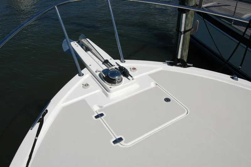 Double D Yacht Photos Pics 2014 Back Cove 37 boat deck with anchor and railing in marina.