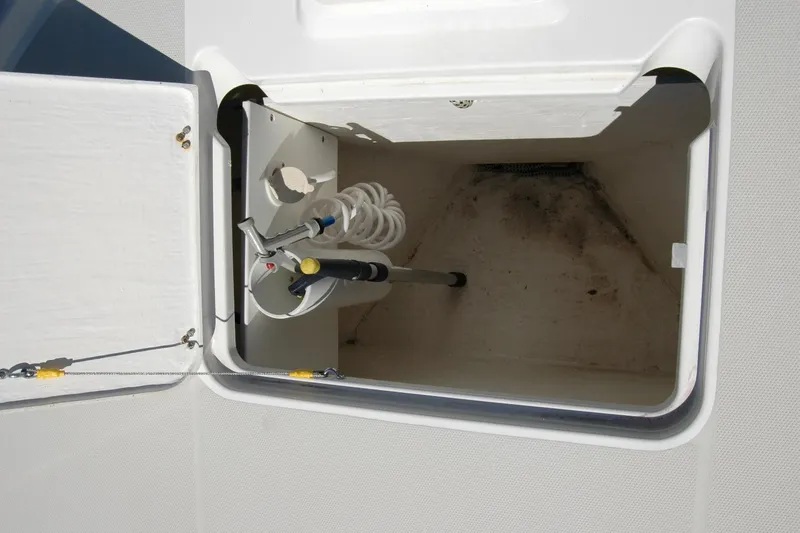 Double D Yacht Photos Pics Storage compartment with hose and nozzle on a 2014 Back Cove 37 boat.
