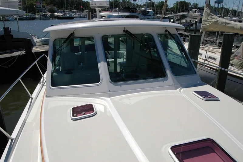 Double D Yacht Photos Pics 2014 Back Cove 37 boat docked at marina, showcasing front deck and windows.