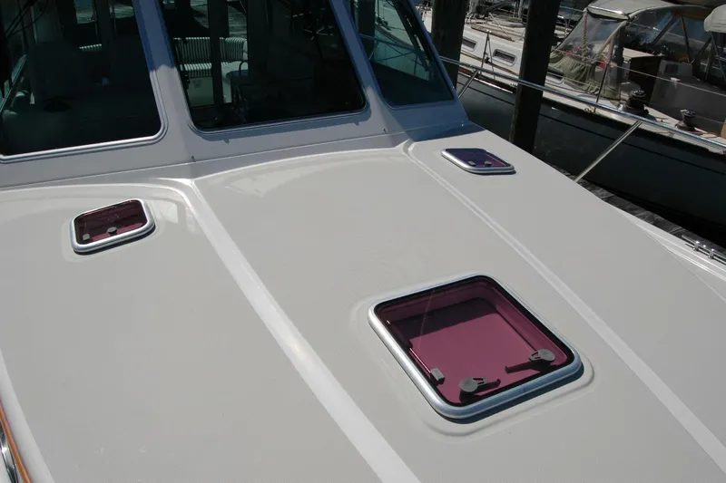 Double D Yacht Photos Pics 2014 Back Cove 37 boat deck with purple hatches, docked at marina.