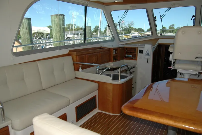 Double D Yacht Photos Pics Interior of a 2014 Back Cove 37 yacht with seating, kitchenette, and helm station.