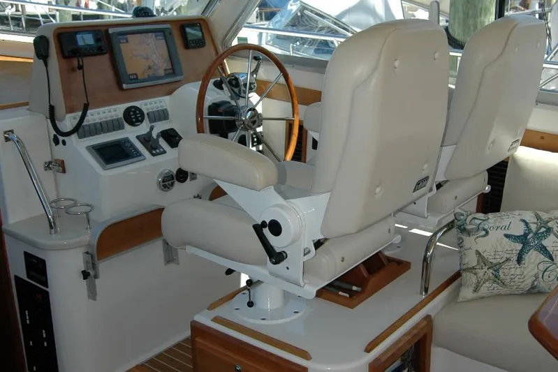 Double D Yacht Photos Pics Helm station of 2014 Back Cove 37 with dual seats and navigation equipment.