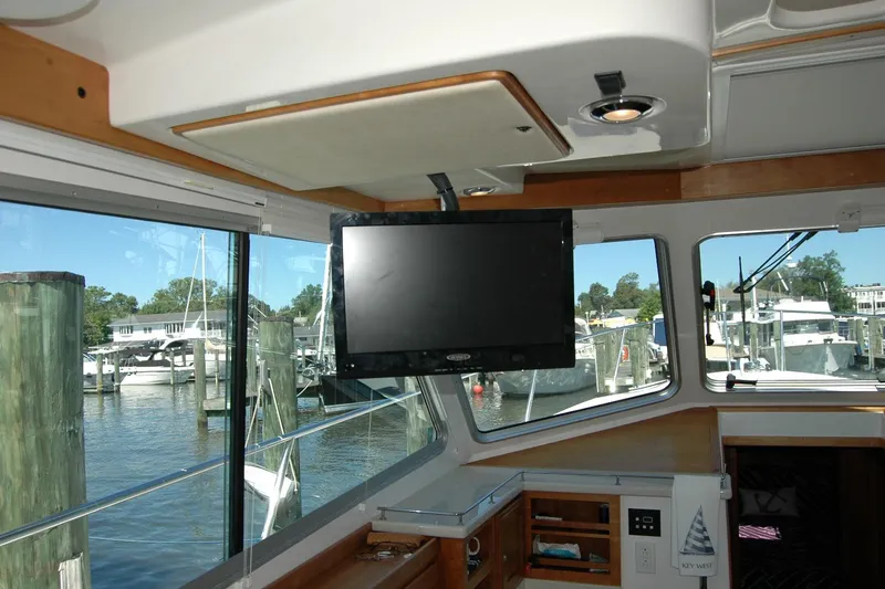 Double D Yacht Photos Pics Interior of 2014 Back Cove 37 yacht with TV and marina view.