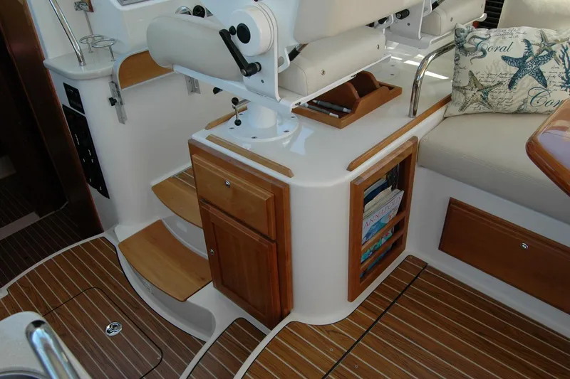 Double D Yacht Photos Pics 2014 Back Cove 37 yacht interior with wooden cabinetry and seating area.