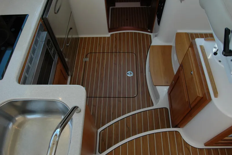 Double D Yacht Photos Pics 2014 Back Cove 37 yacht interior with wood flooring and modern kitchen amenities.