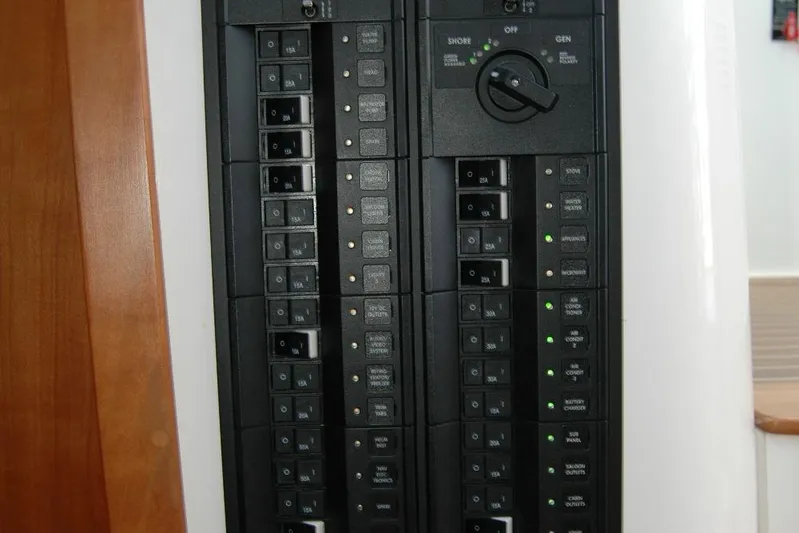 Double D Yacht Photos Pics Electrical panel of a 2014 Back Cove 37 boat, featuring circuit breakers and switches.