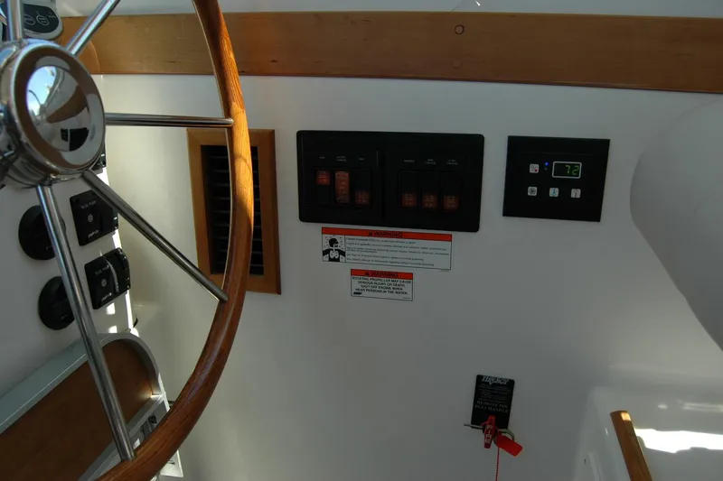 Double D Yacht Photos Pics 2014 Back Cove 37 helm with wooden steering wheel and control panel.
