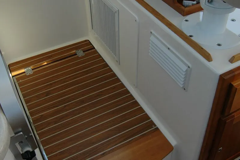 Double D Yacht Photos Pics 2014 Back Cove 37 interior with wooden flooring and white paneling.