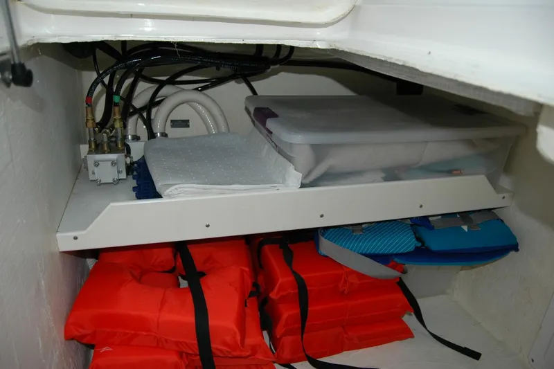 Double D Yacht Photos Pics Storage compartment in a 2014 Back Cove 37 boat with life jackets and supplies.