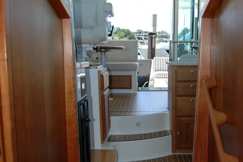 Double D Yacht Photos Pics Interior view of 2014 Back Cove 37 yacht with wooden cabinetry and seating area.