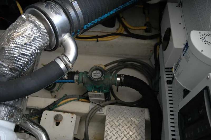Double D Yacht Photos Pics Engine compartment of a 2014 Back Cove 37 boat, showing hoses and mechanical components.