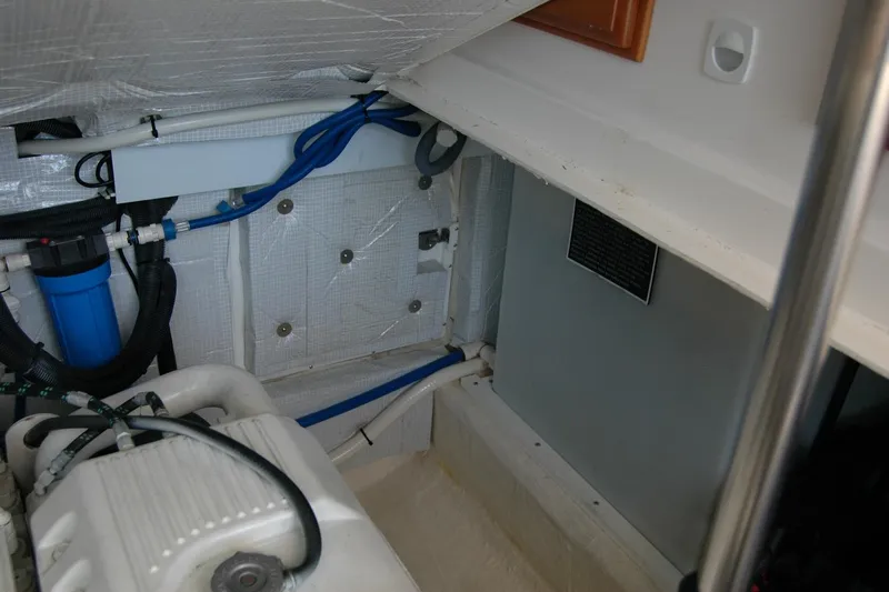 Double D Yacht Photos Pics Engine compartment of a 2014 Back Cove 37 boat, featuring hoses and components.
