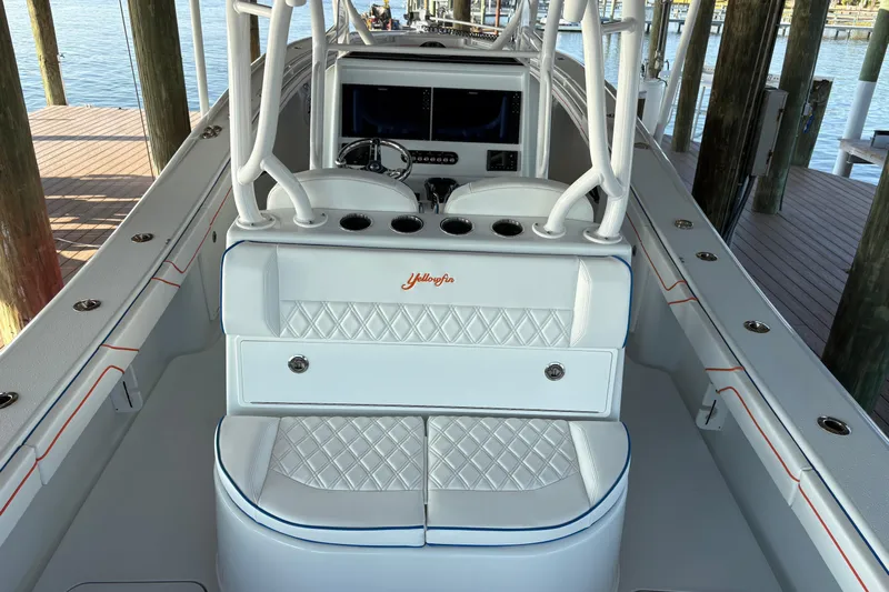  Yacht Photos Pics 2024 Yellowfin 36 Offshore boat interior with white seating and diamond stitching.