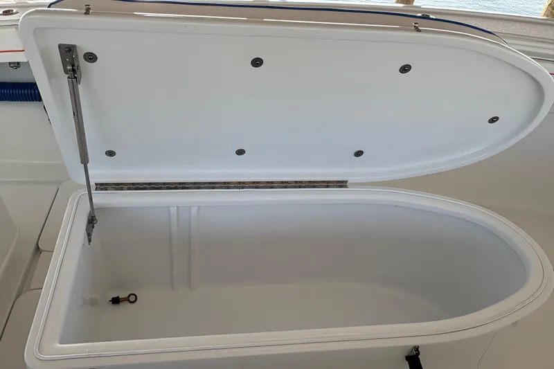  Yacht Photos Pics Open storage compartment on 2024 Yellowfin 36 Offshore boat, showcasing interior space.