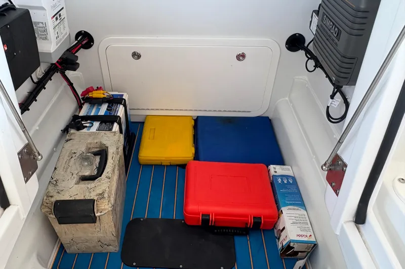 Yacht Photos Pics Storage compartment of 2024 Yellowfin 36 Offshore boat with equipment and supplies.