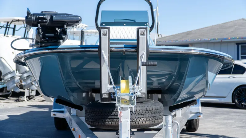  Yacht Photos Pics 2025 SCB S22 boat on trailer, front view, in a parking lot.