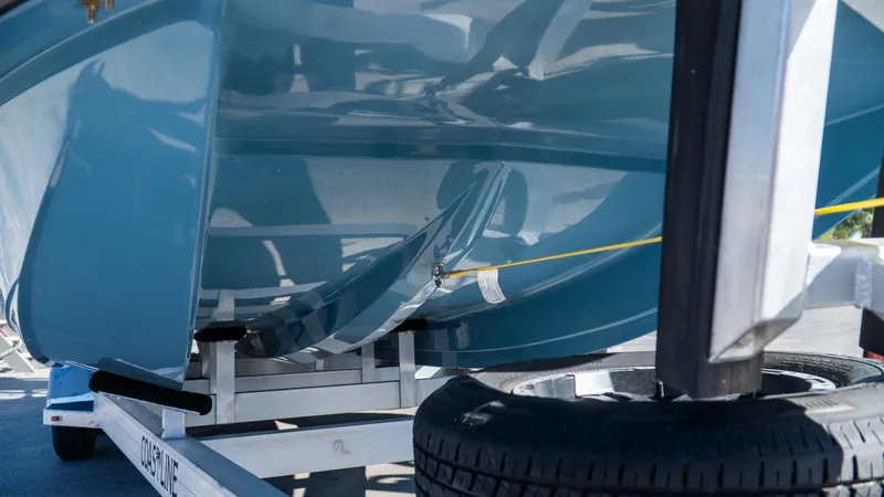  Yacht Photos Pics Close-up of a 2025 SCB S22 boat hull on a trailer.