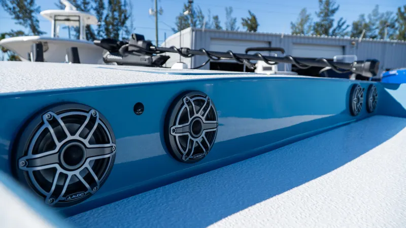  Yacht Photos Pics 2025 SCB S22 boat with sleek blue design and built-in speakers.