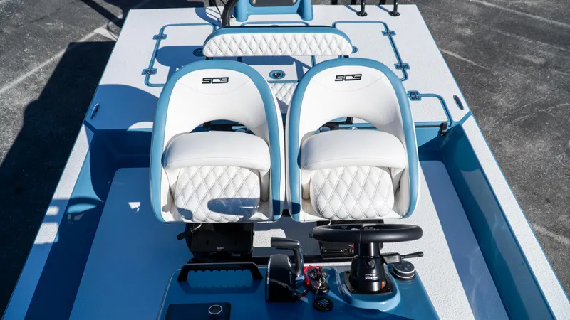  Yacht Photos Pics 2025 SCB S22 boat interior with dual white seats and steering console.