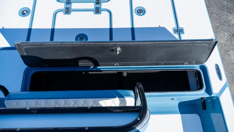  Yacht Photos Pics 2025 SCB S22 boat storage compartment with open hatch, showcasing interior space.